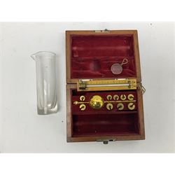 Victorian Sikes's Hydrometer in mahogany case with weights and thermometer; together with Sikes's book of spirit tables and three-piece barrel measure in case; Tensometer Ltd. pair of Elongation and Reduction in Area gauges; cased; and set of early 20th Century portable balance scales by De Grave Short & Co, London in rectangular wood box with  base drawer (5)