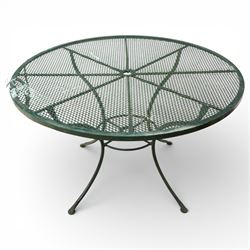 Green painted wrought metal garden table and chairs, with green striped cushions 