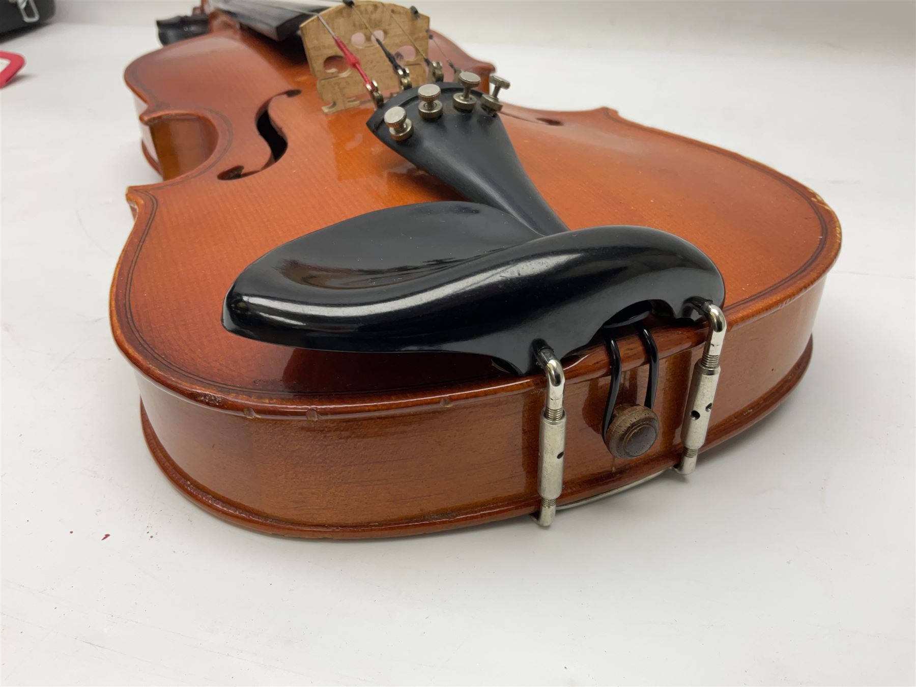 Four student violins - two Chinese three-quarter size with 33.5cm and 34cm two-piece backs; Stringers of Edinburgh quarter size with 28cm two-piece back; and Stentor quarter size with 28cm two-piece back; each in carrying case (4)
