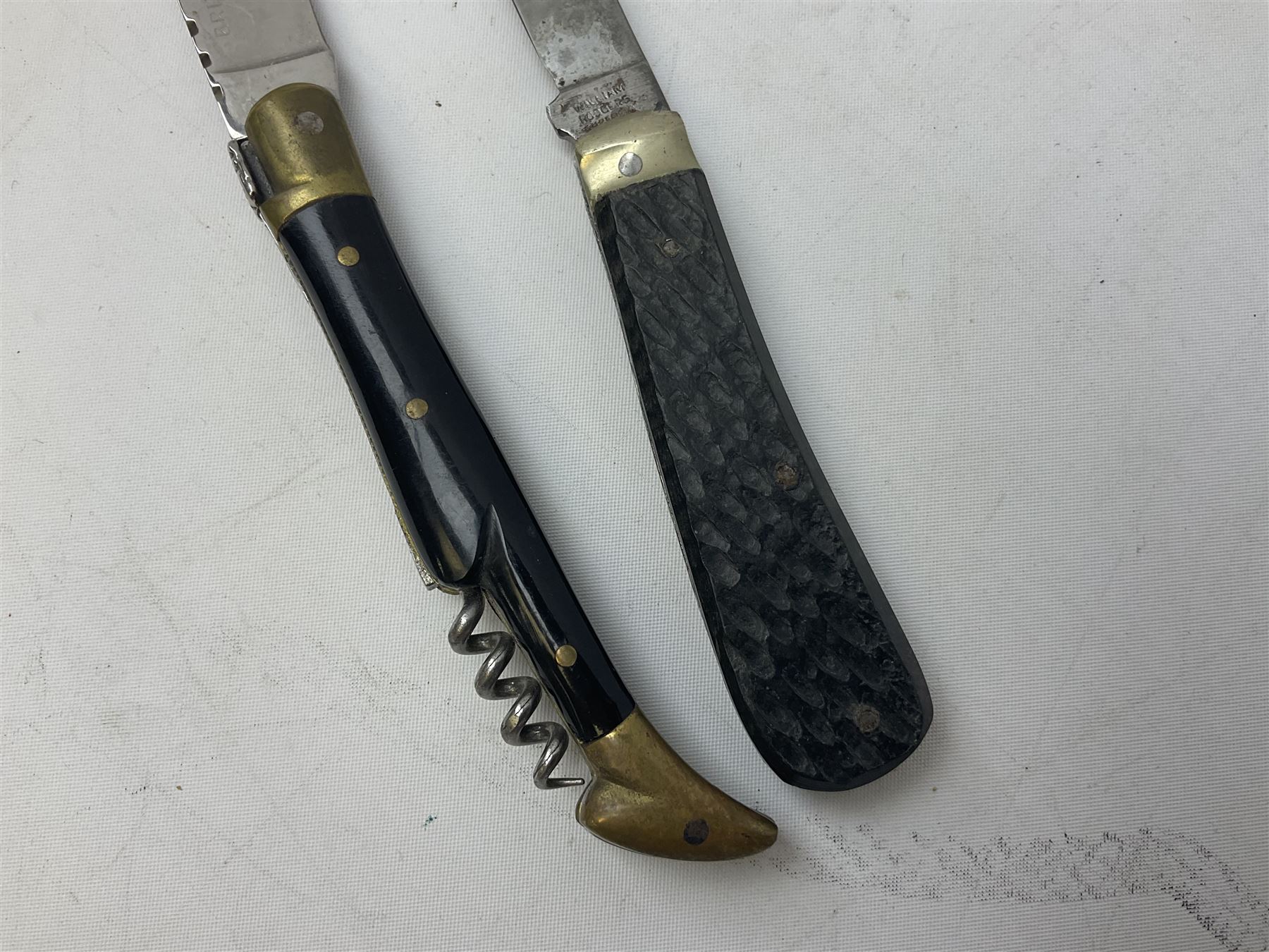 Laguiole pocket knife, with brass mounts and Bee mouche, L19.5cm open, together with a further William Rodgers Sheffield knife