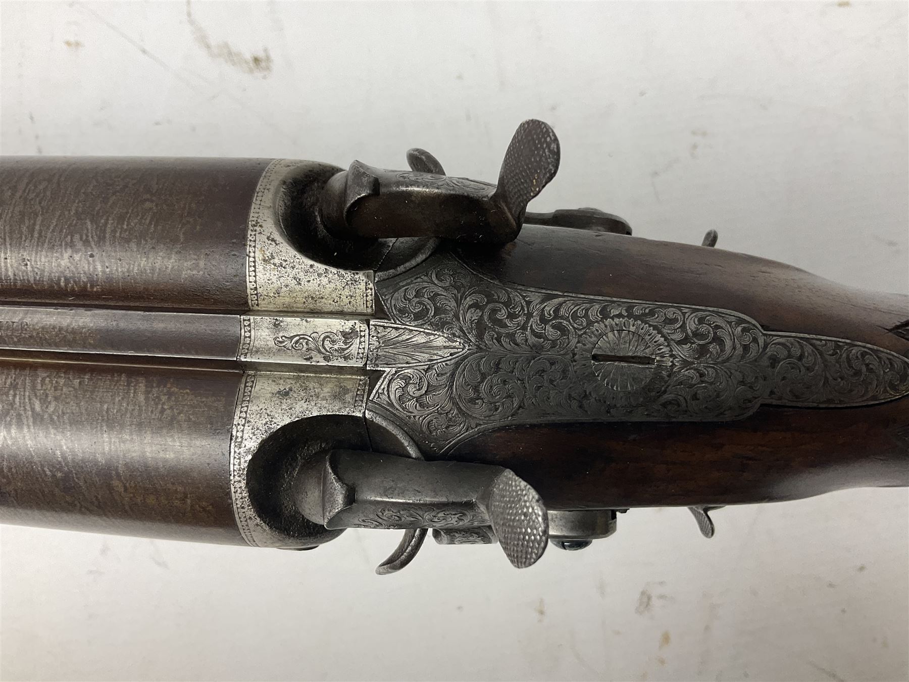 19th century John Jefferson of Scarborough 6-bore (modern 4-bore) double barrel side-by-side percussion gun, with 81cm stub twist damascus barrels (no provision for ramrod), well figured walnut stock with fine chequered grip and fore-end with horn tip and steel butt plate with long tang, well engraved lock and hammers with half-cock safeties on both sides, barrel sling swivel but rear sling swivel removed and replaced with silver escutcheon, London proofmarks, NVN, L128cm