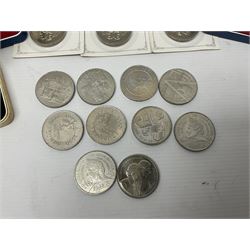 Queen Elizabeth II 1977 silver crown and 1980 silver crown, both cased with certificates, Bailiwick of Guernsey 1978 silver crown cased without certificate, three United Kingdom brilliant uncirculated five pound coins in card folders and twelve other five pound coins
