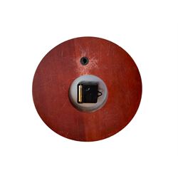 20th century marine clock with a mahogany surround and cast brass “porthole” bezel, with a 6” dial and Swiss battery operated quartz movement.