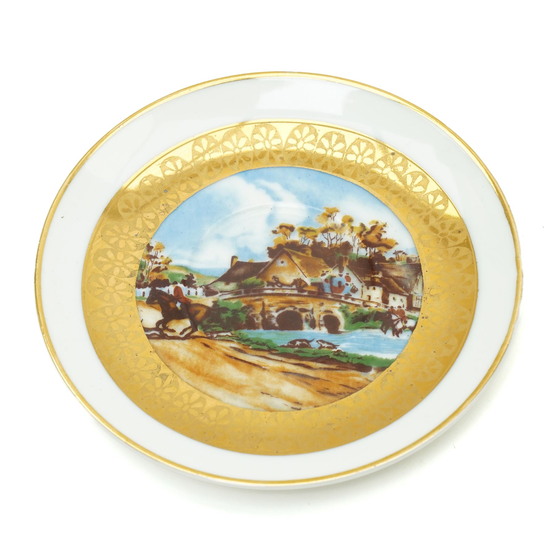 Limoges  coffee set decorated with hunting scenes within a gilt border comprising twelve cups and saucers, coffee pot, cream jug and sugar bowl