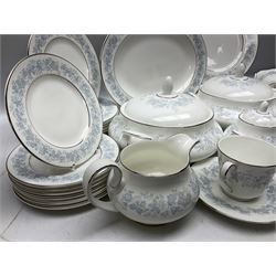 Royal Doulton tea and dinner wares in the Meadow Mist pattern, no H5007, comprising seven dinner plates, eight side plates, two lidded tureens, two jugs, lidded sucrier, oval serving dish, six teacups, seven saucers, seven tea plates and large saucer