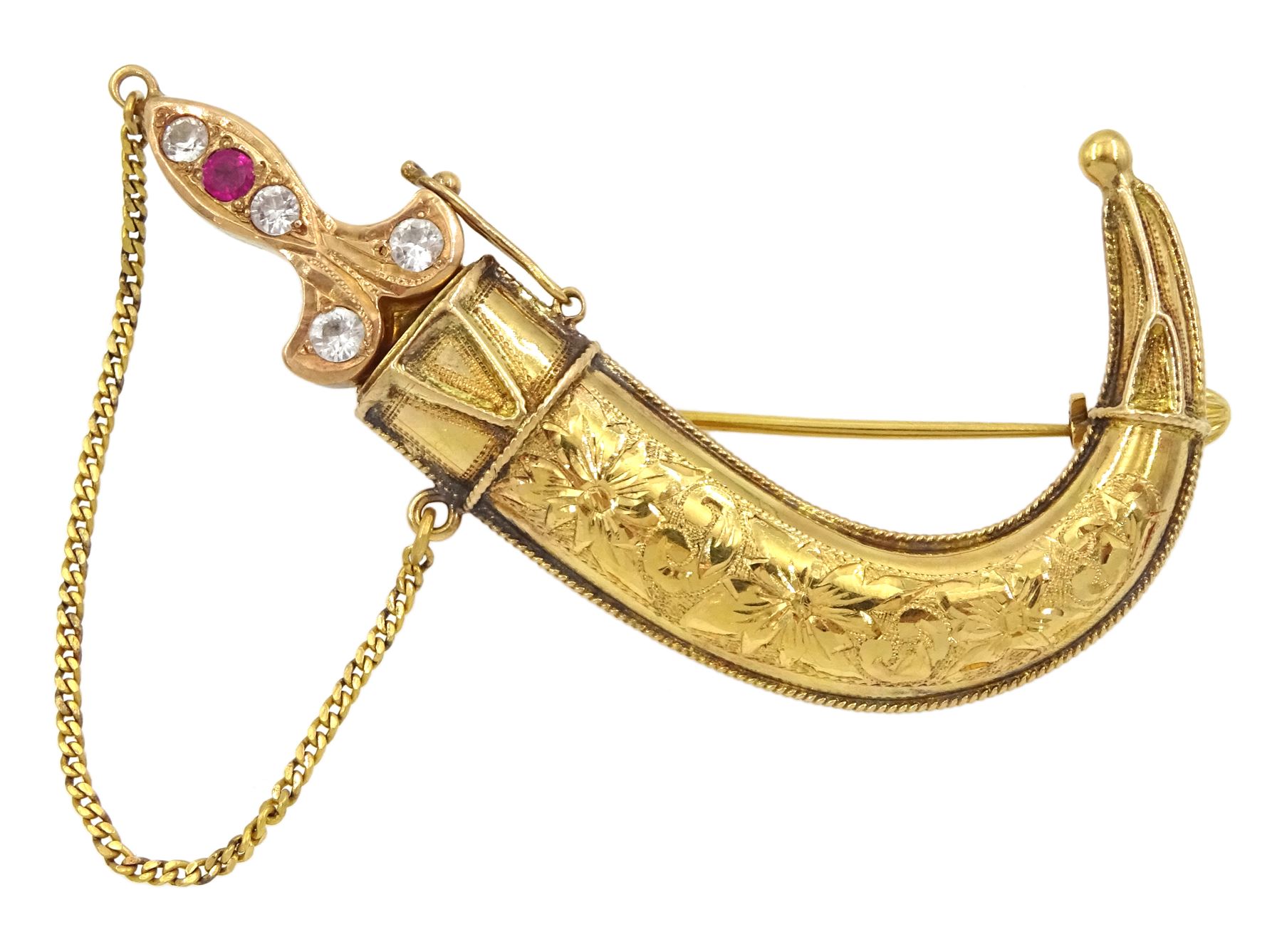 Early 20th century 20ct gold Middle Eastern Jambiya dagger brooch, the rose gold handle set with paste stones and scabbard with engraved floral decoration 