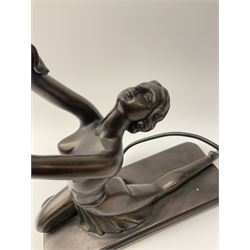 An Art Deco style composite bronze effect table lamp by Crosa, modelled as a semi nude female figure supporting a spherical crackle effect shade in her outstretched hand, overall approximately H47cm.