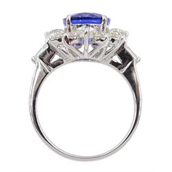 
18ct white gold oval tanzanite and round brilliant cut diamond cluster ring, with tapered baguette diamond shoulders, stamped 750, tanzanite 3.56 carat, total diamond weight 1.60 carat, with World Gemological Institute Report