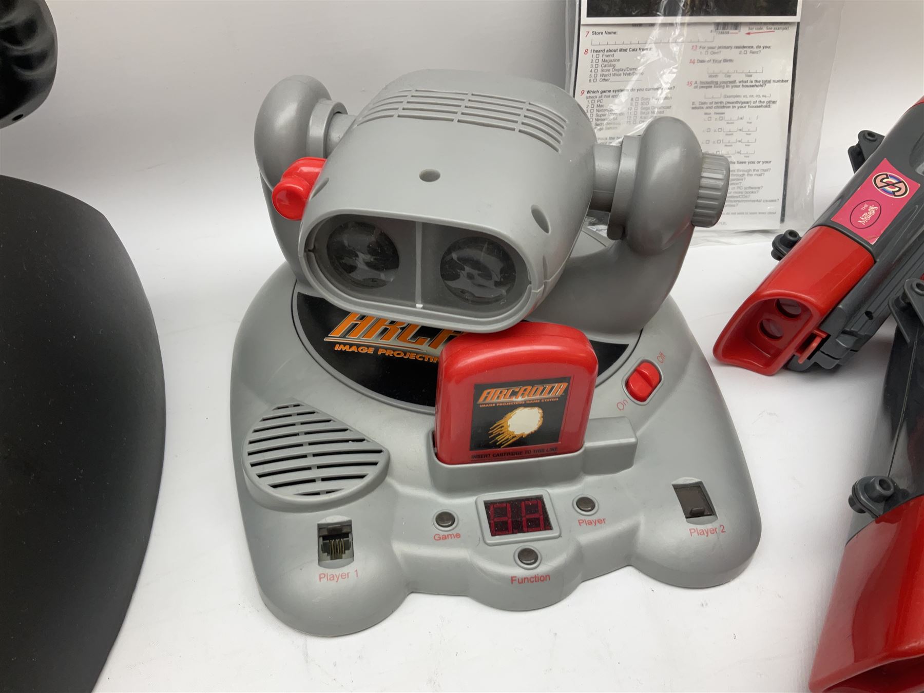 Mad Catz Dual Force Racing Wheel and Foot control for Playstation; Arcadia Image Projecting Game System; pair of Captain Scarlet and the Misterons phaser guns etc