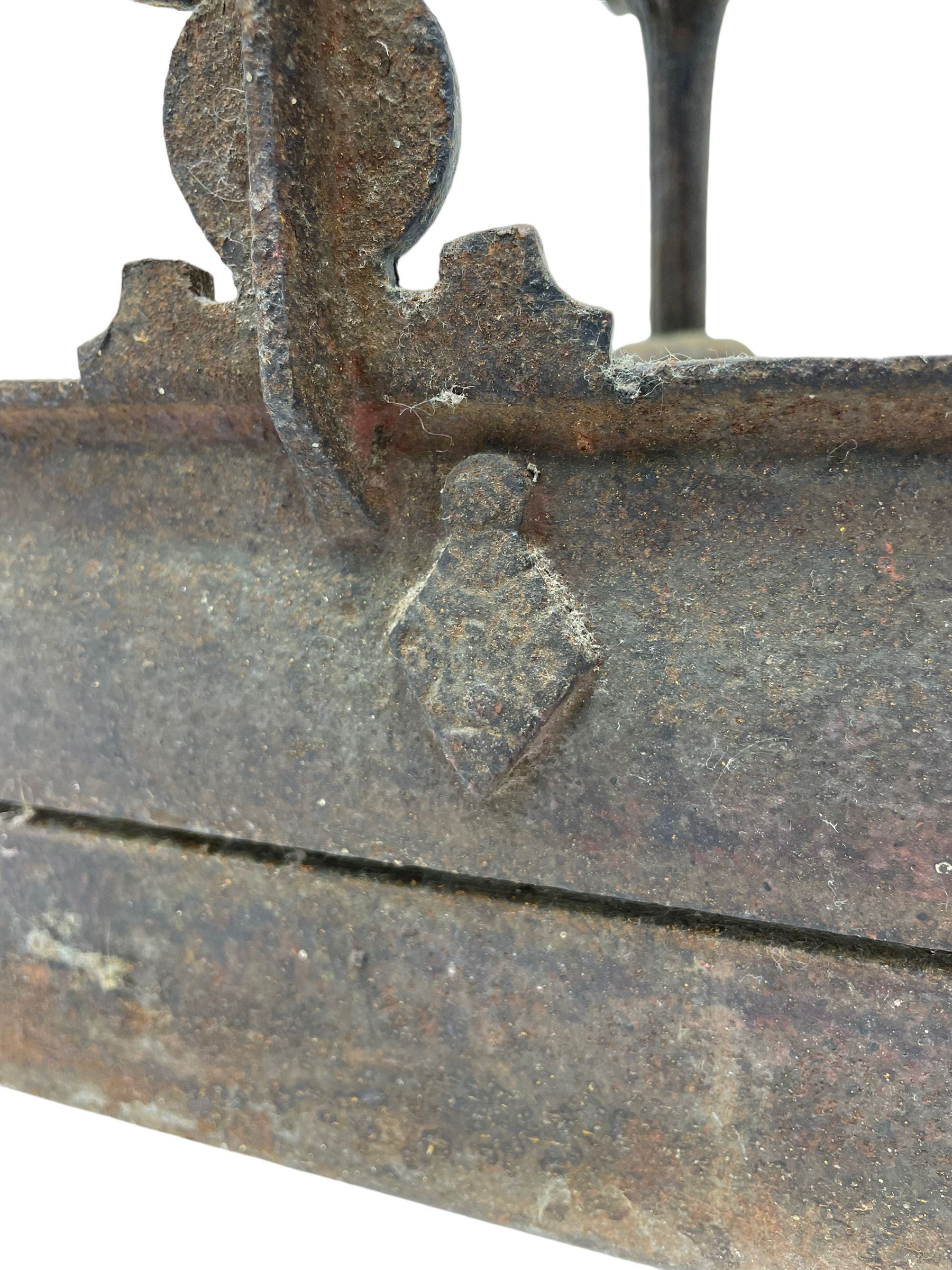19th century cast iron hallway hat and coat stand, the arched frame decorated with overlapping foliage, central oval mirror surrounded by trailing oak leaves and acorns, with extending umbrella and stick stand, the curved plinth base decorated with acanthus leaves, with impressed and mounted R.d. lozenges