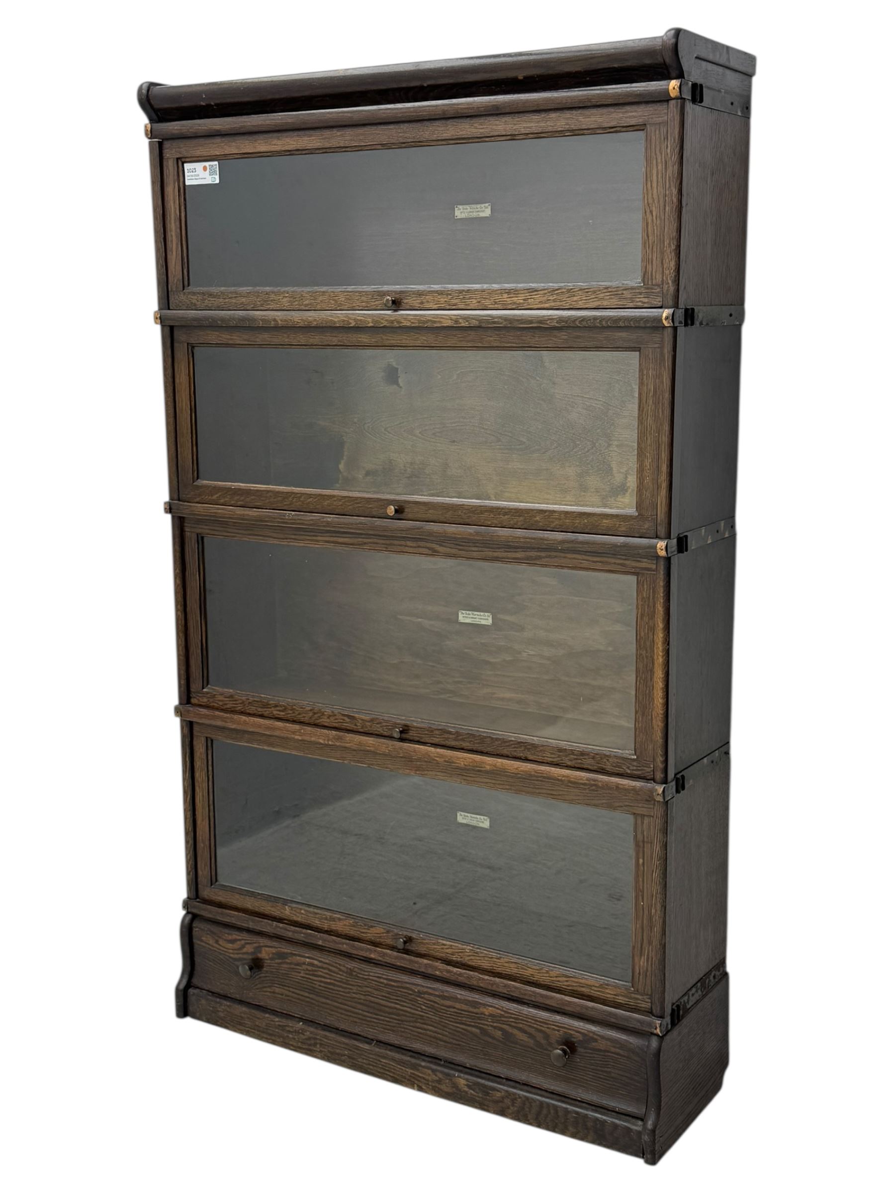 Globe Wernicke - stacking sectional library bookcase, over four glazed up-and-over doors, each bearing original makers mark, on moulded plinth base with inbuilt drawer