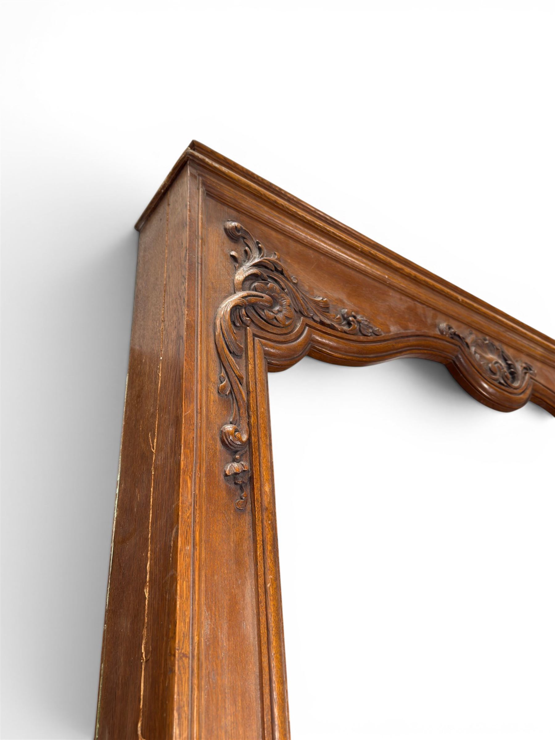 Early 20th century French oak window surround, shaped top with carved shell and acanthus leaf detail 
