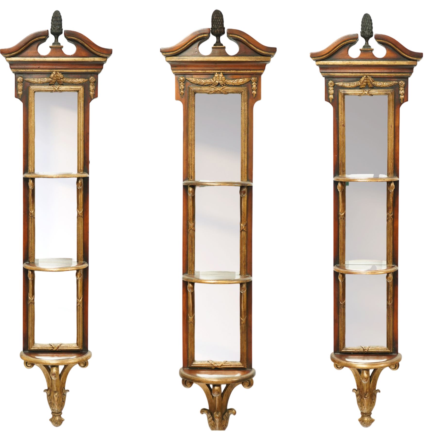 Theodore Alexander - three contemporary neoclassical design giltwood and mahogany three-sectional pier mirrors, broken pediment with central bronze urn finial above triple mirror plates, flanked by gilt acanthus-carved supports and moulded frame 