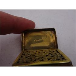 George III silver-gilt vinaigrette, of rectangular form, with rounded corners, with rim embossed in high relief with floral decoration and hinged cover with engine turned decoration and blank rectangular cartouche, Birmingham 1797, maker's mark TS, L2.7cm