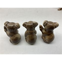 Five Beswick Koala bears, comprising two large koalas no.1038, koala on branch no. 1039 and baby koala no.1040