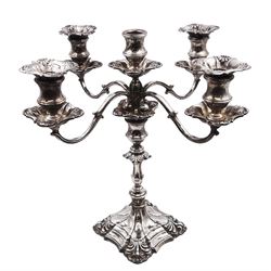 Modern silver five branch candelabra centrepiece, the four extending branches each with removable sconces, surrounding a central candle holder, upon a knopped stem and weighted stepped square foot, with anthemion to each corner, hallmarked Roberts & Belk, Sheffield 1984, H36cm 