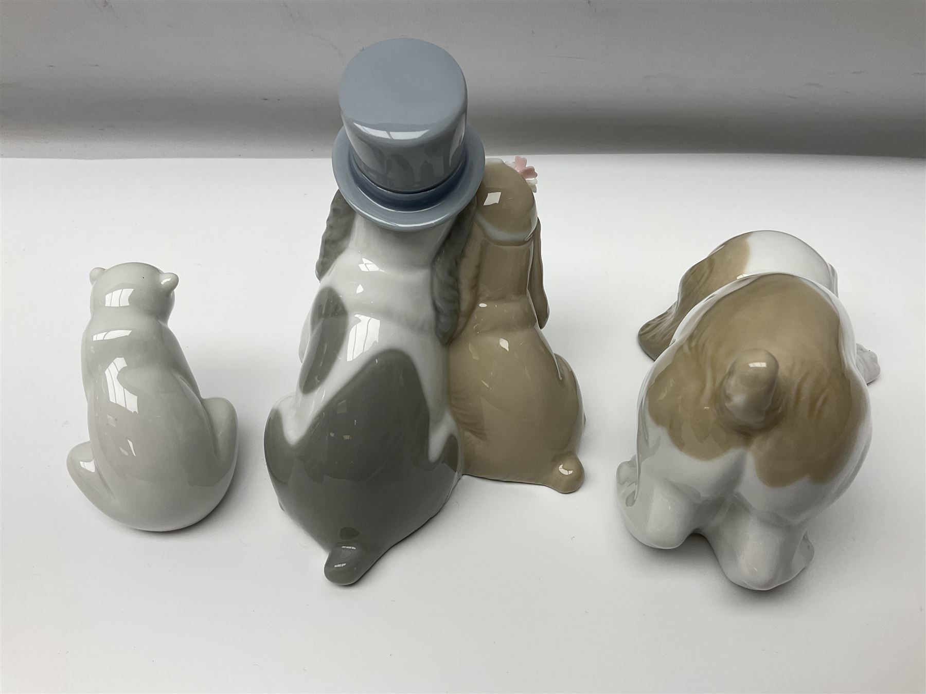 Ten Nao figures, to include three Cheeky Cherubs, Cat, Dog bride and groom etc