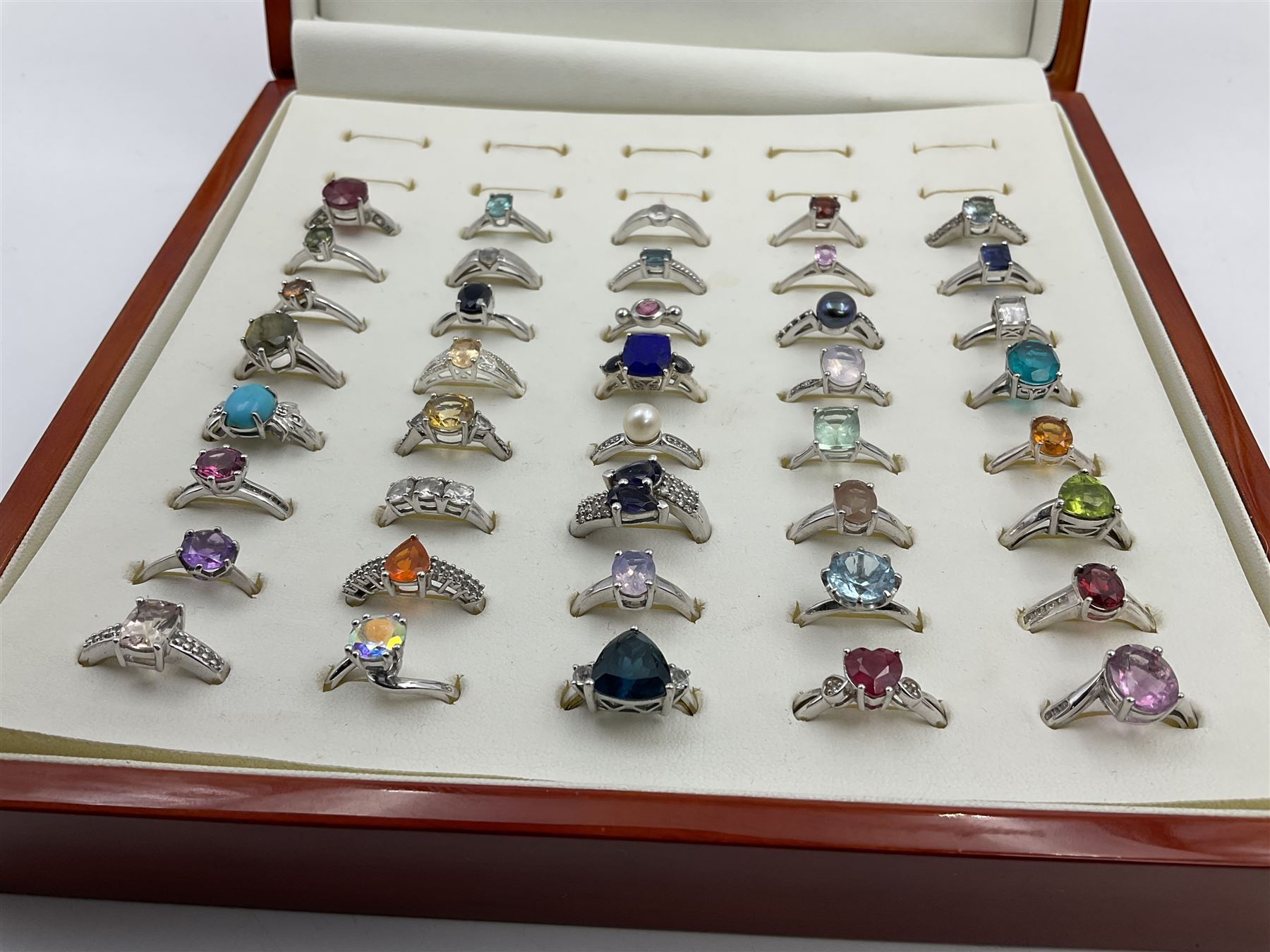 Silver Collector Rings Forty silver stone-set rings, including ruby, topaz, pearl, labradorite ...