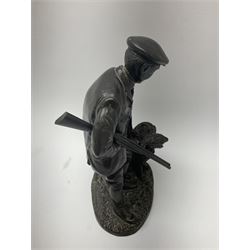 Bronzed figure of a man with a shotgun and a dog, impressed W Elphick 1979, H23cm