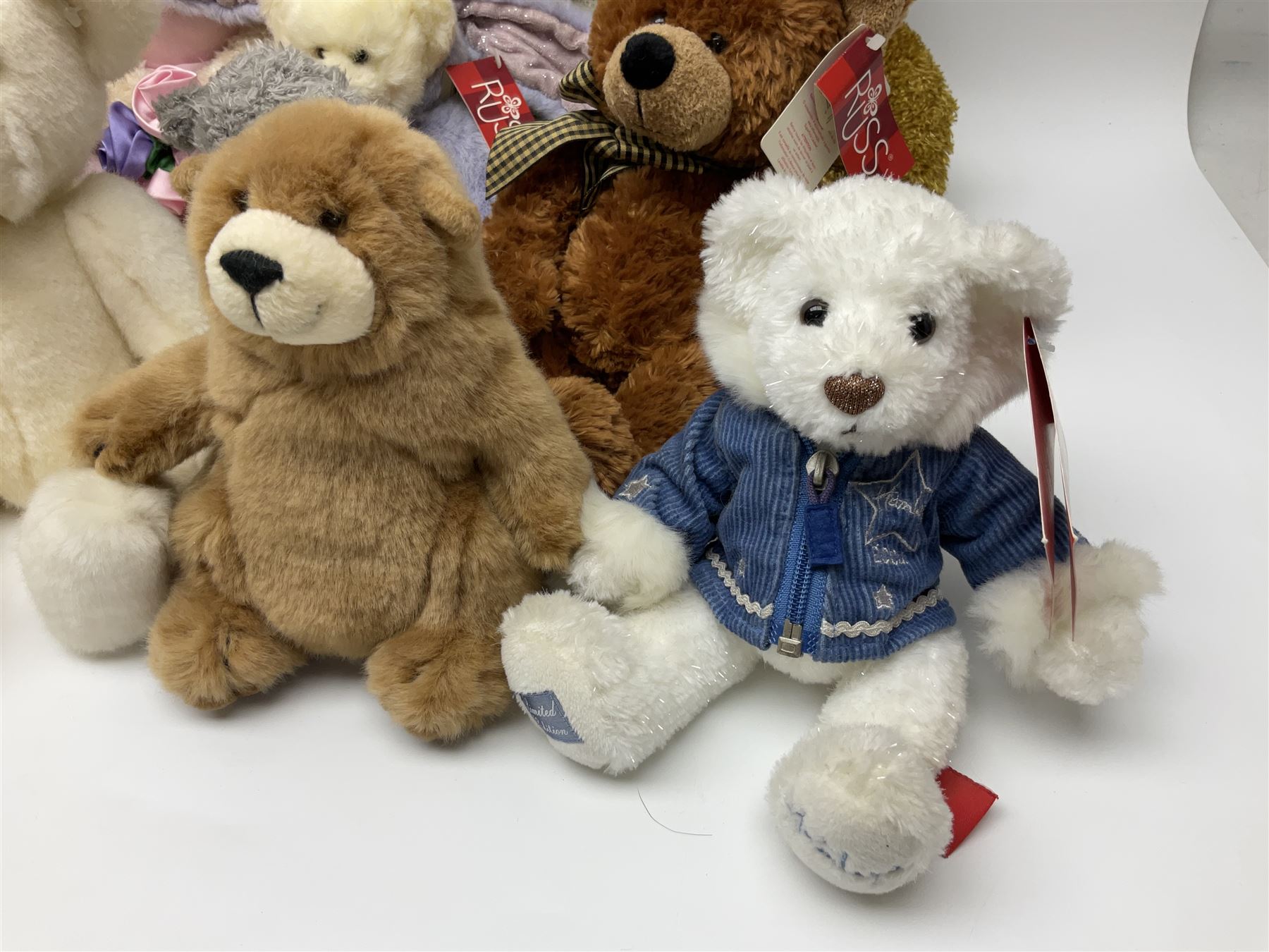 Eighteen Russ teddy bears including Ariella, Chloe, Spencer and Desmond,  mostly with tags, together with six other soft toys, tallest H42cm (24)