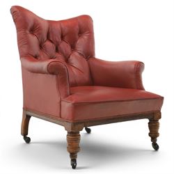 Early 20th century style oxblood red leather Chesterfield armchair, deep buttoned shaped b...
