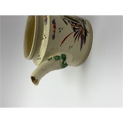 18th century creamware teapot, probably Leeds, with reeded entwined handle and floral finial to the cover, the body with hand painted polychrome decoration of figure to one side, and floral spray to the other, collectors paper label beneath inscribed Leeds Pottery, H11.5cm