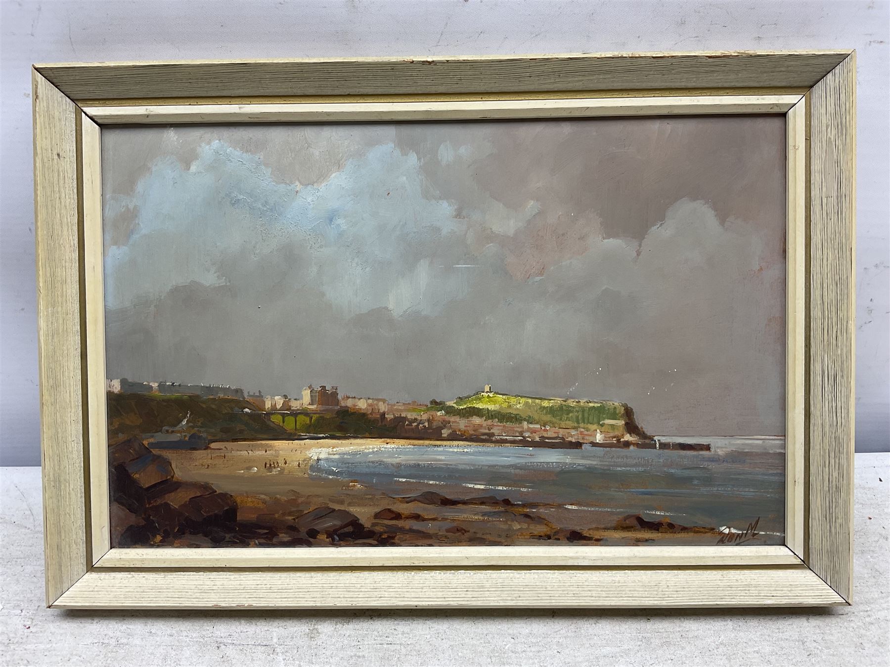 Don Micklethwaite (British 1936-): South Bay Scarborough, oil on board signed 18cm x 28cm