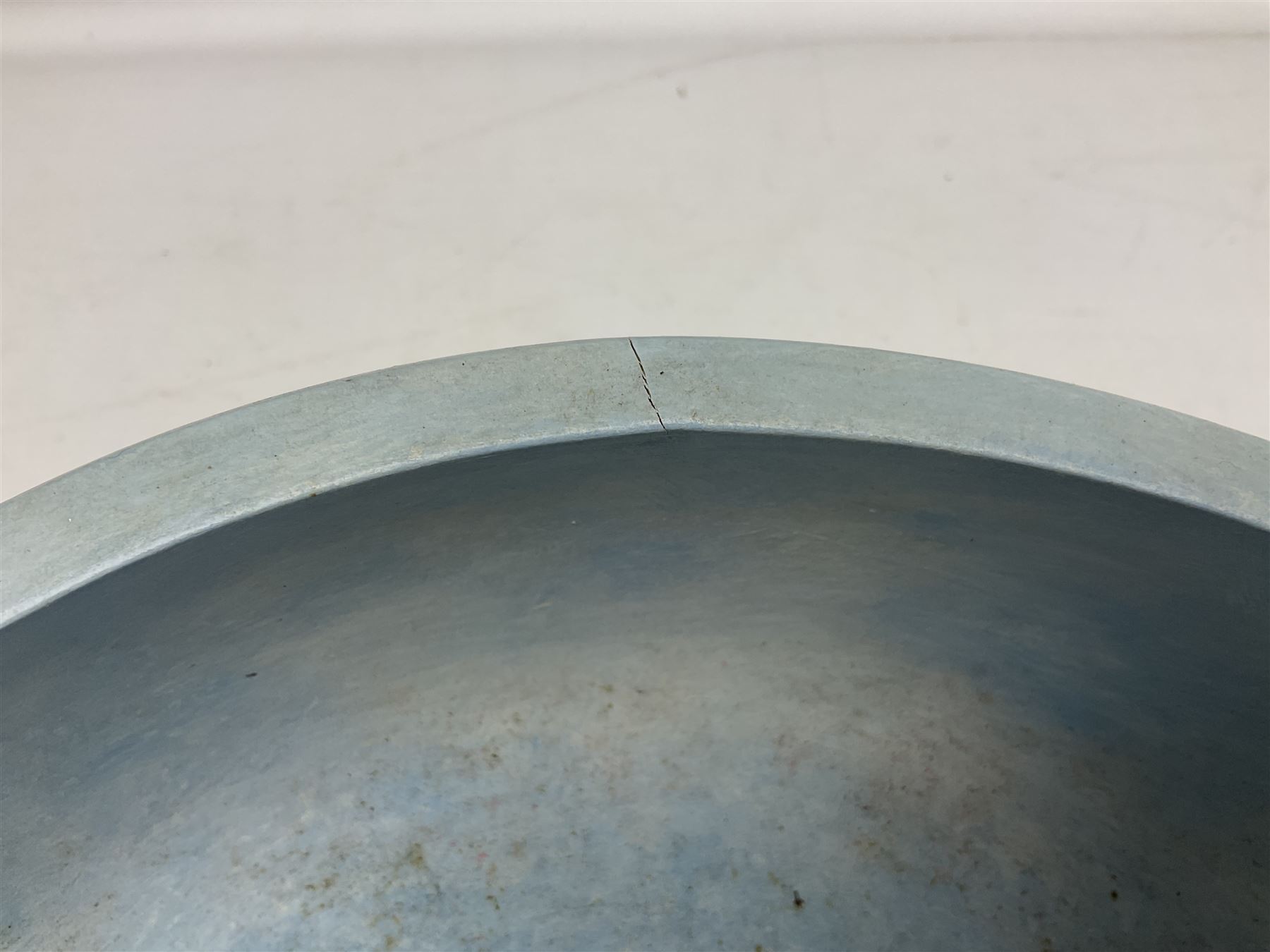 Wooden hand painted bowl, decorated with trees on a blue ground, signed Phil Crennell beneath, D28cm