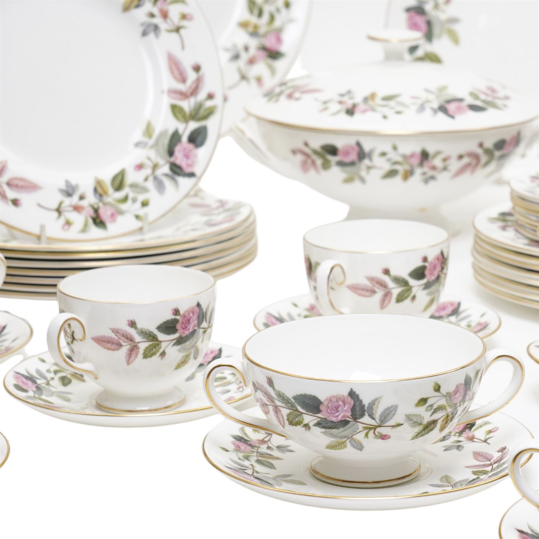 Wedgwood Hathaway Rose pattern tea and dinner wares, comprising two covered tureens, two oval serving dishes, eight dinner plates, eight dessert plates,  six side plates, eight soup bowls and stands, four teacups and saucers, and a sauce boat and stand