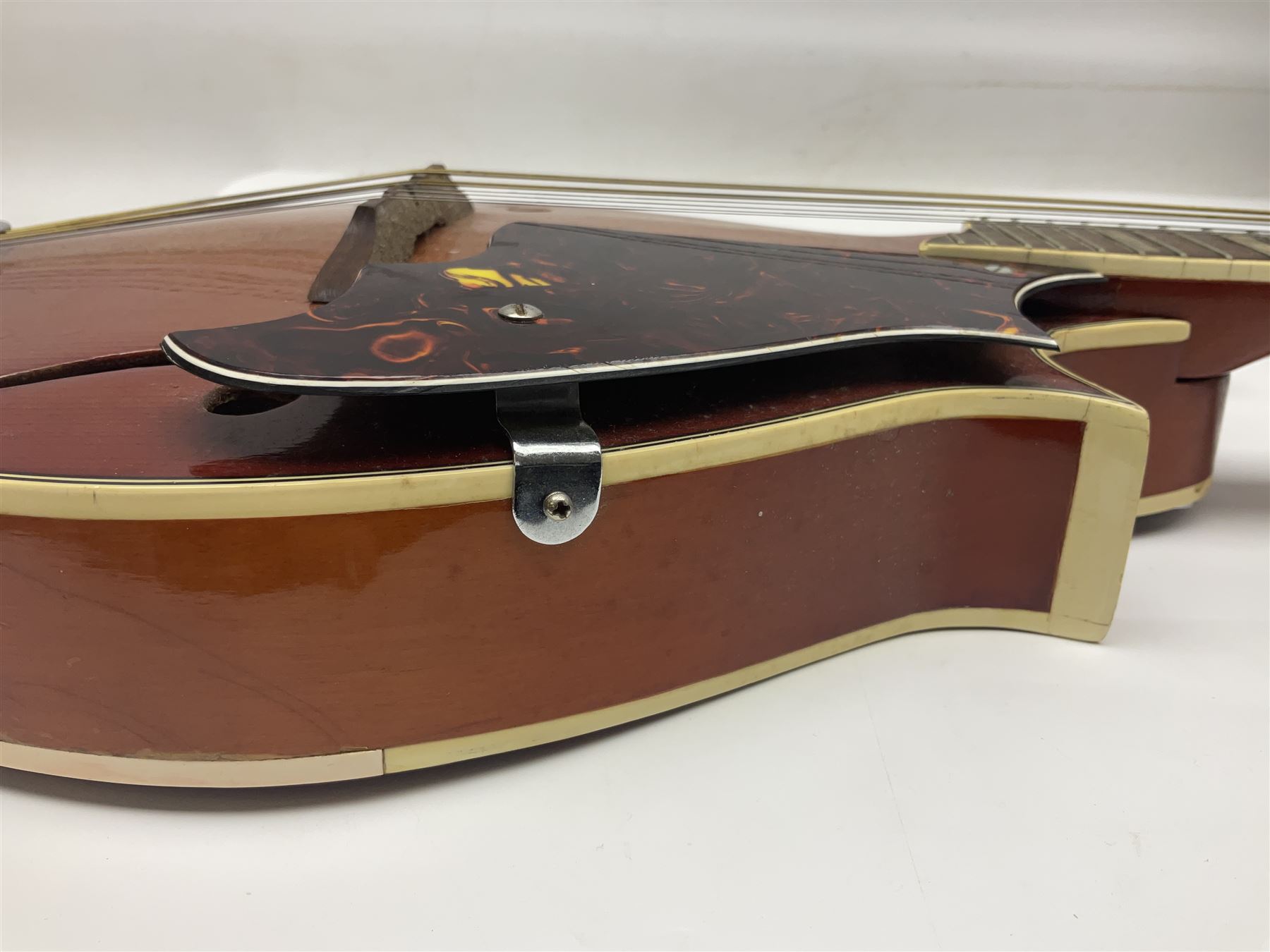 Eastern eight-string mandolin with sunburst finish and mother-of-pearl inlay L68.5cm; and another Harmony mandolin with cracked headstock (2)