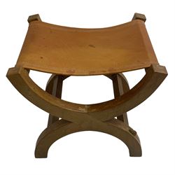 Mouseman - oak curved X-framed stool with slug tan leather seat, carved with mouse signature, by the workshop of Robert Thompson, Kilburn