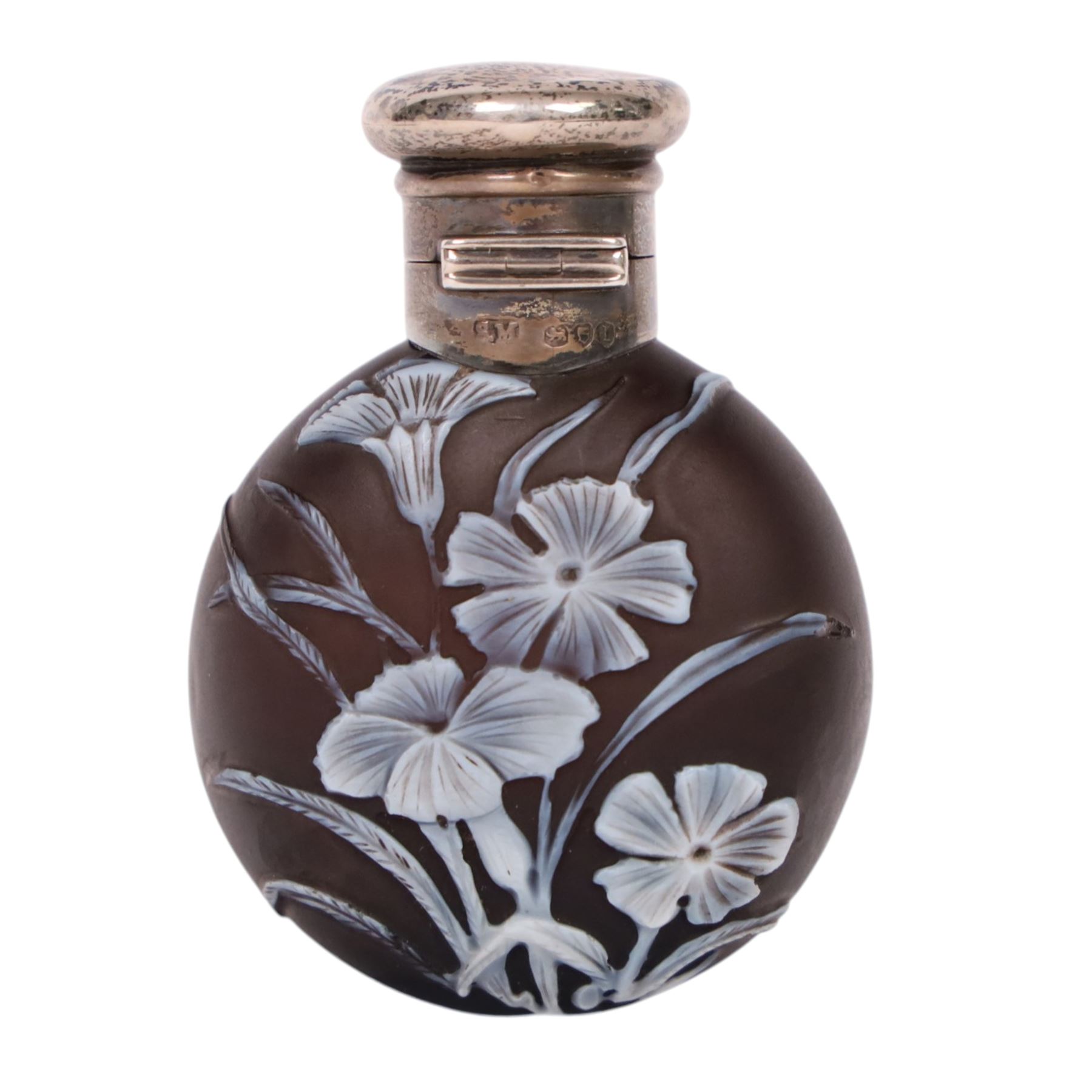 Victorian Thomas Webb silver mounted cameo glass scent bottle, hallmarked Sampson Mordan and Co, London 1884, the cameo glass body of circular form, decorated with white flowers and foliage in high relief upon a black ground, the hinged cover opening to reveal the original stopper, H6cm 