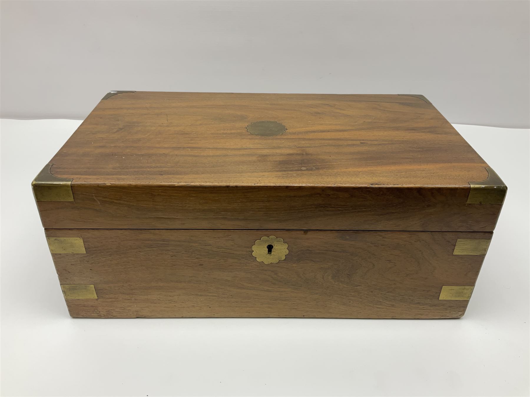 19th century burr yew wood tea caddy, of sarcophagus form, with strung details and brass mounts, the interior split into three compartments, upon four brass bun feet, together with an oak and brass bound writing slope, with red leather interior with gilt detailing, largest H16cm, W40cm