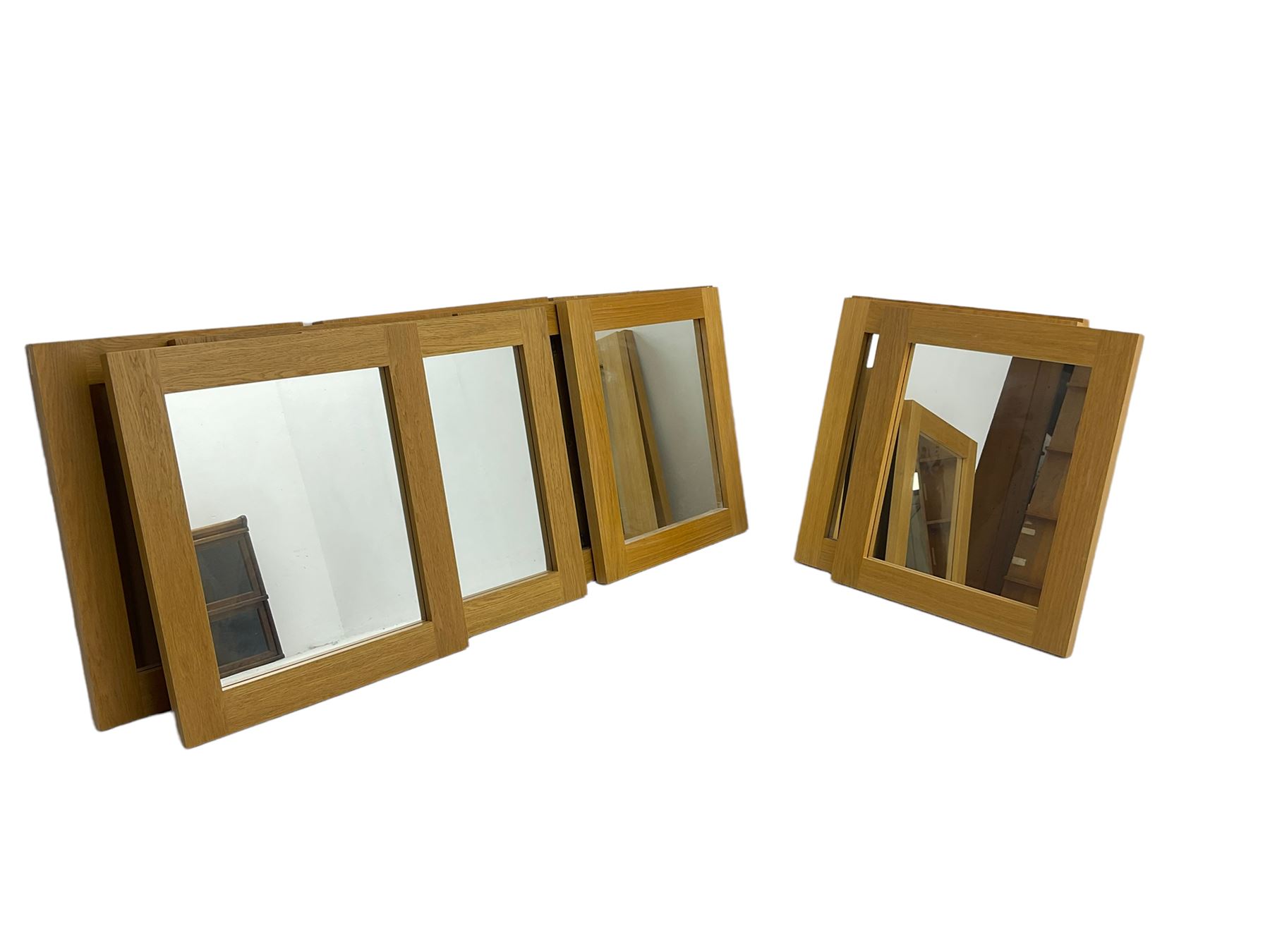 Ten oak framed rectangular mirrors, and a smaller oak framed mirror