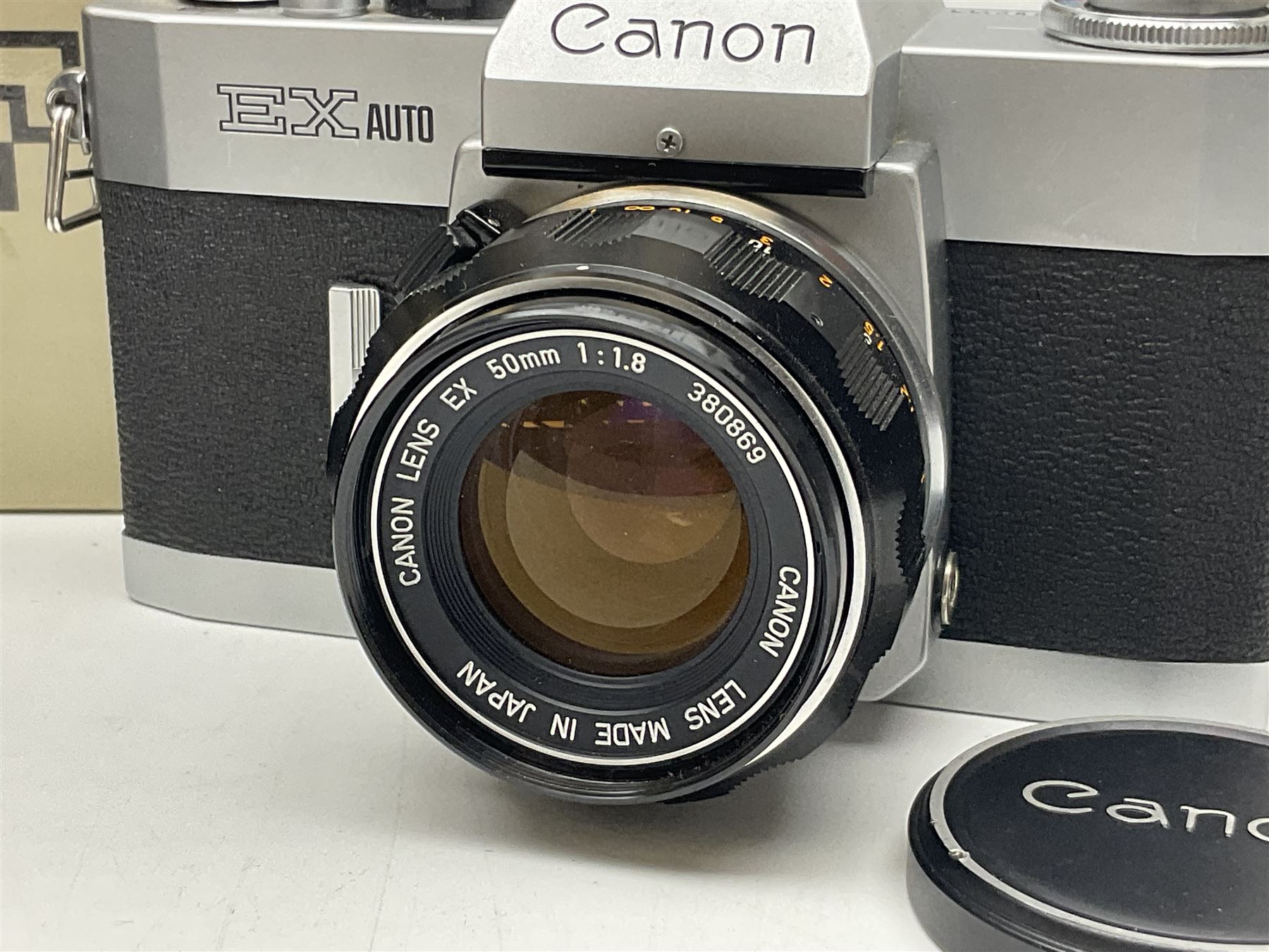 Canon FTb camera body, serial no. 715838, with 'Canon FD 50mm 1:1.8' lens, serial no. 207888, in original box, together with Canon FTb camera body, serial no. 557817, with 'Canon FD 35mm 1:3.5 S.C' lens, serial no. 126210 and Canon EX Auto camera body, serial no. 296244 with 'Canon EX 50mm 1:1.8' lens, serial no. 380869  
