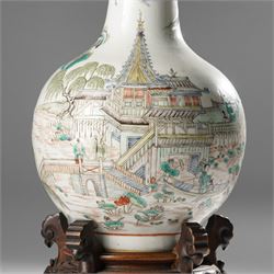 Chinese Kangxi period famille verte vase, the body finely painted with a continuous narrative scene of figures inside and out of a pavilion complex, beside a river, rocks and trees, character mark to base, raised upon a hardwood stand, overall H47cm