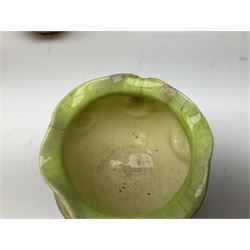 Linthorpe pottery vase with crimped rim and ovoid body, Linthorpe jug with high loop handle and crimped spout, a pair of candlesticks with a green, brown glaze and other similar pottery 