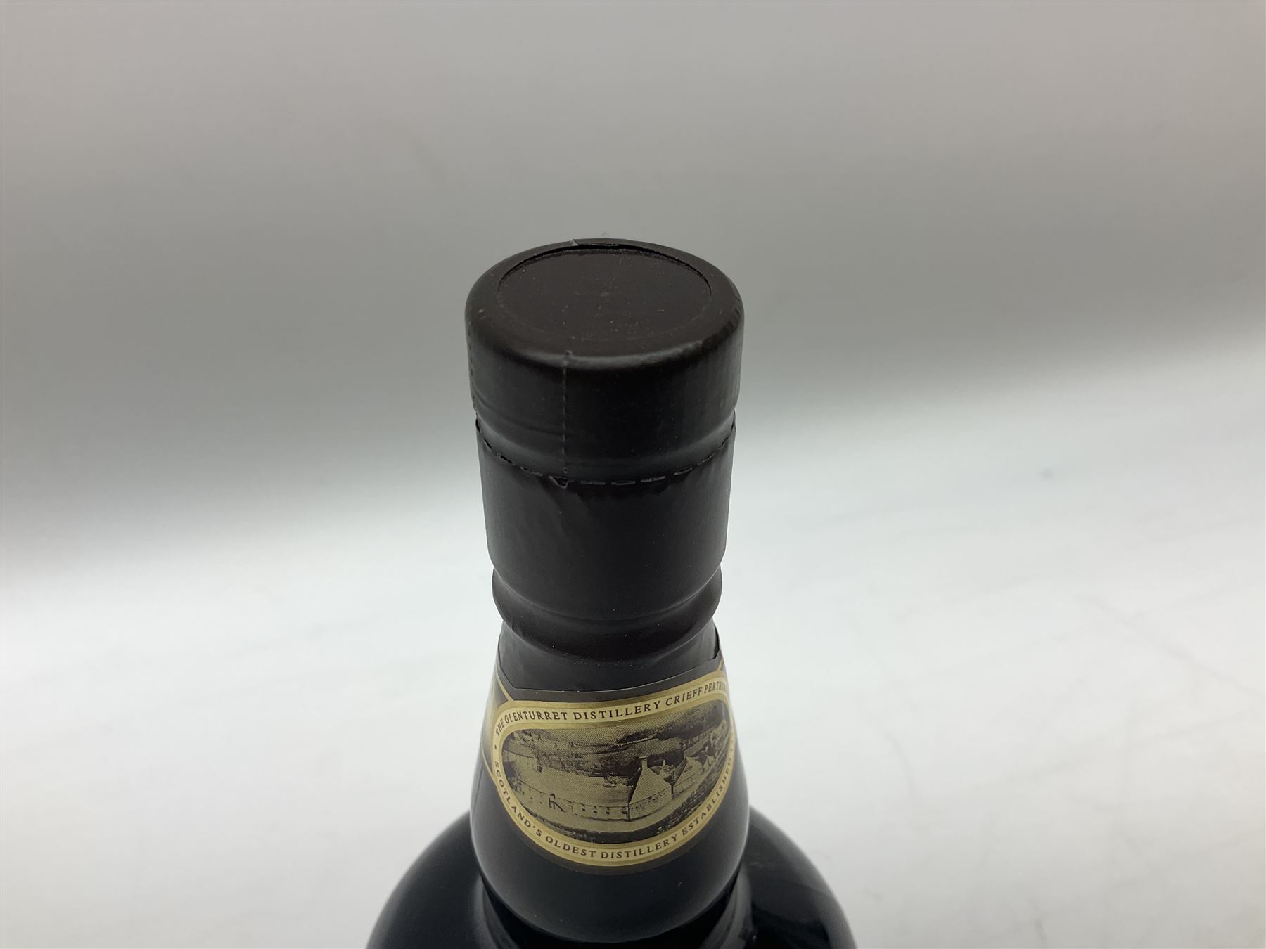 The Glenturret malt liqueur, 70cl, 35%vol and a Bell's Scotch Whisky decanter commemorating The marriage of Prince Andrew with Miss Sarah Ferguson 23rd July 1986, 75cl (2)