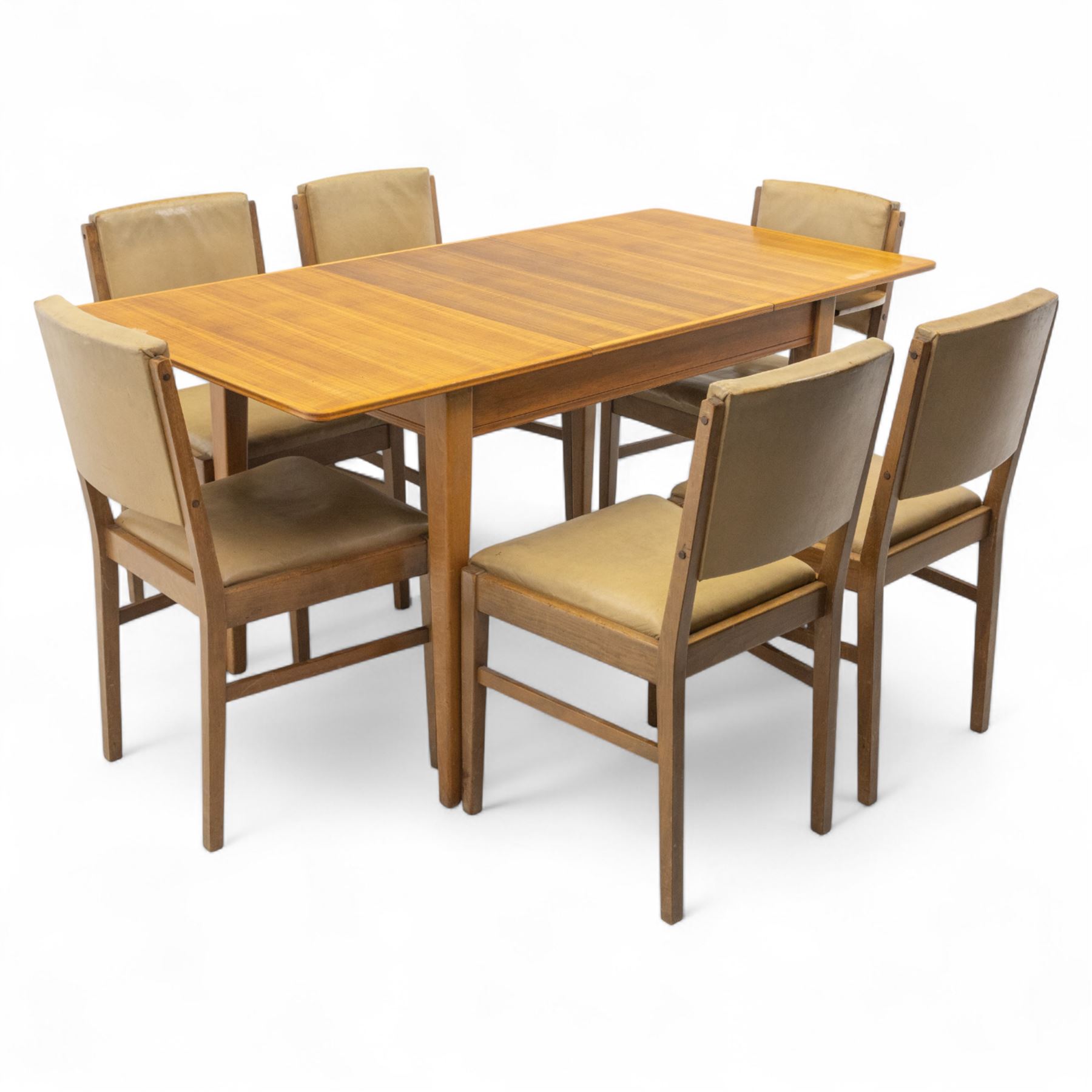 Gordon Russell - mid 20th century teak dining suite, comprising rectangular extending dining table and six matching chairs including one carver, each chair with padded upholstered seat and backrest in vinyl, on square supports, the table with plain top and rounded edges on tapered legs, an example of the firm’s functional post-war design with restrained modernist detailing (Chairs H 85cm, W 47cm, D 46cm) (Extends to 154cm)