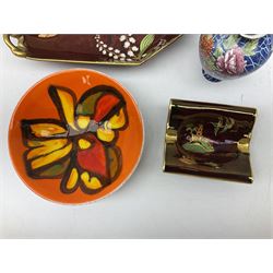 Shelley Cloisonne pattern vase, Carlton Ware Rouge Royal pattern twin handed dish and ash tray decorated with pagoda and Poole Delphis shallow bowl with geometric decoration on orange ground, largest L28cm