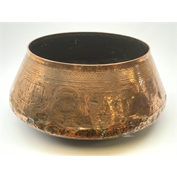 A large copper eastern vessel, of compressed ovoid form detailed with interwoven arabesque decoration, rim D44cm. 