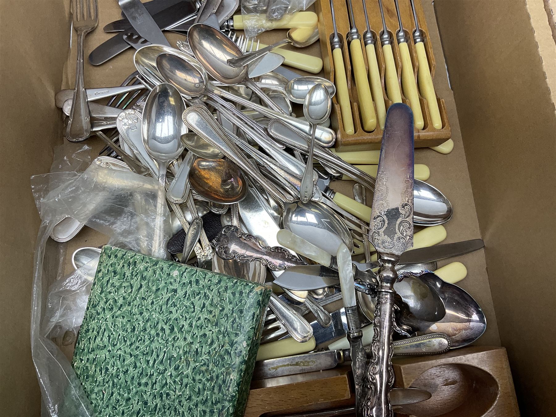 Set of four hallmarked silver teaspoons modelled on spoons from the Roman Imperial period, silver fork, and quantity of silver plated and other cutlery to include Walker & Hall, in two boxes