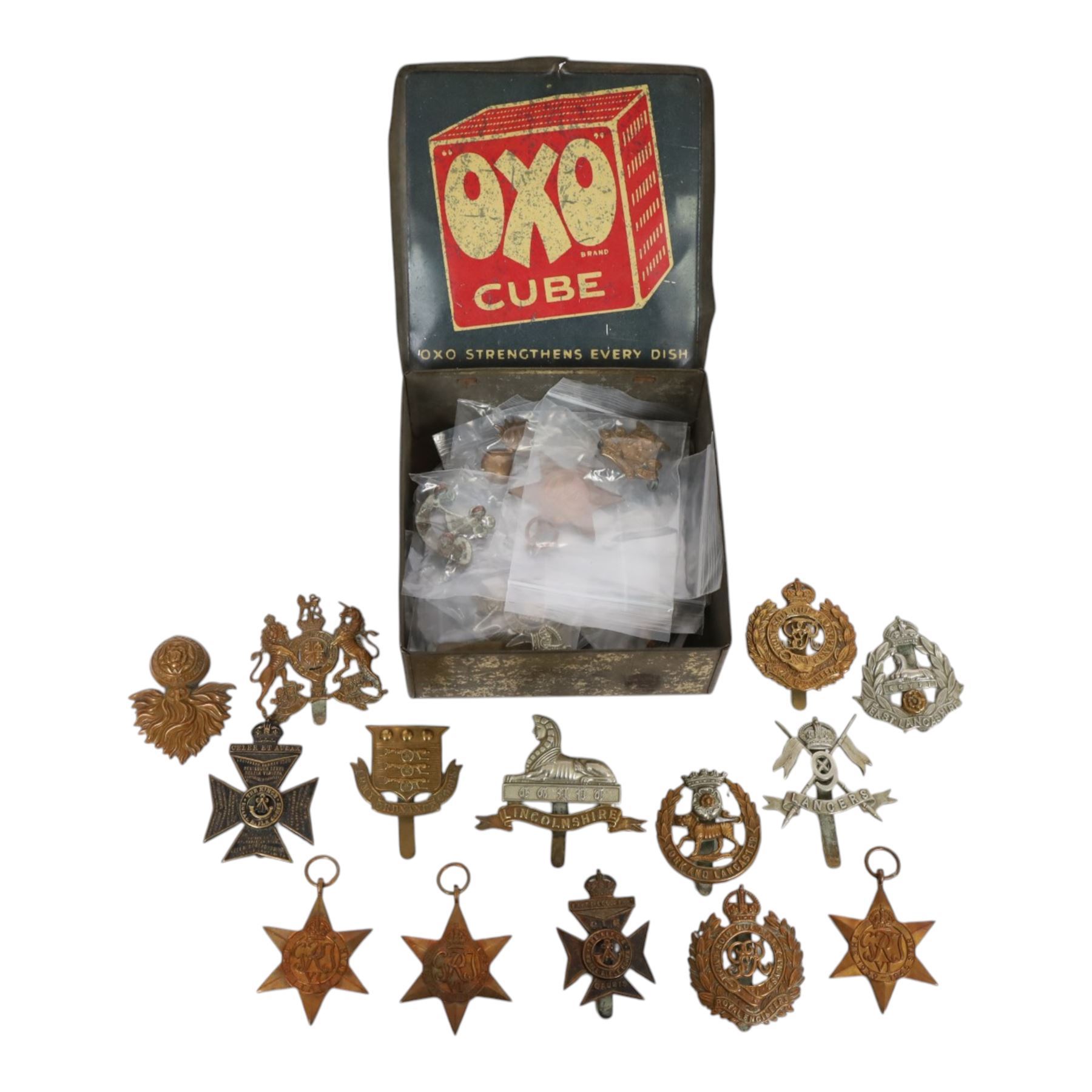 WWII seven British medals, comprising two War medals, two 1939-45 stars, African star, Italy star and French and German star, together with a collection of cap badges including The Kings Royal Rifles, Royal Engineers, East Lancashire, York and Lancaster regiment museum etc  