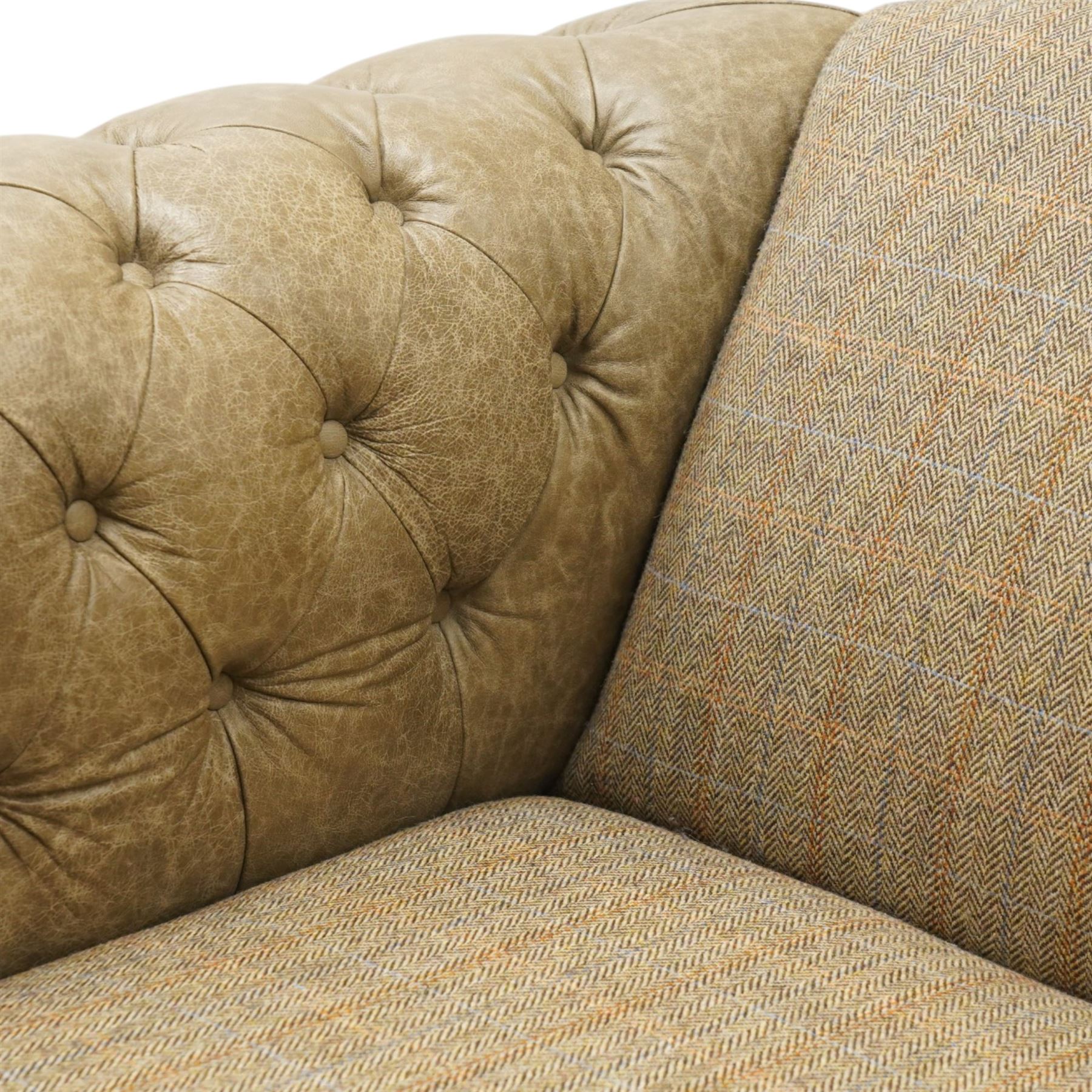 Tetrad - 'Matisse' snuggler armchair or loveseat, Chesterfield shape with rolled arms flanking a serpentine back and front, upholstered in herringbone pattern Harris Tweed and tan leather with close-nailed studwork, on turned feet
