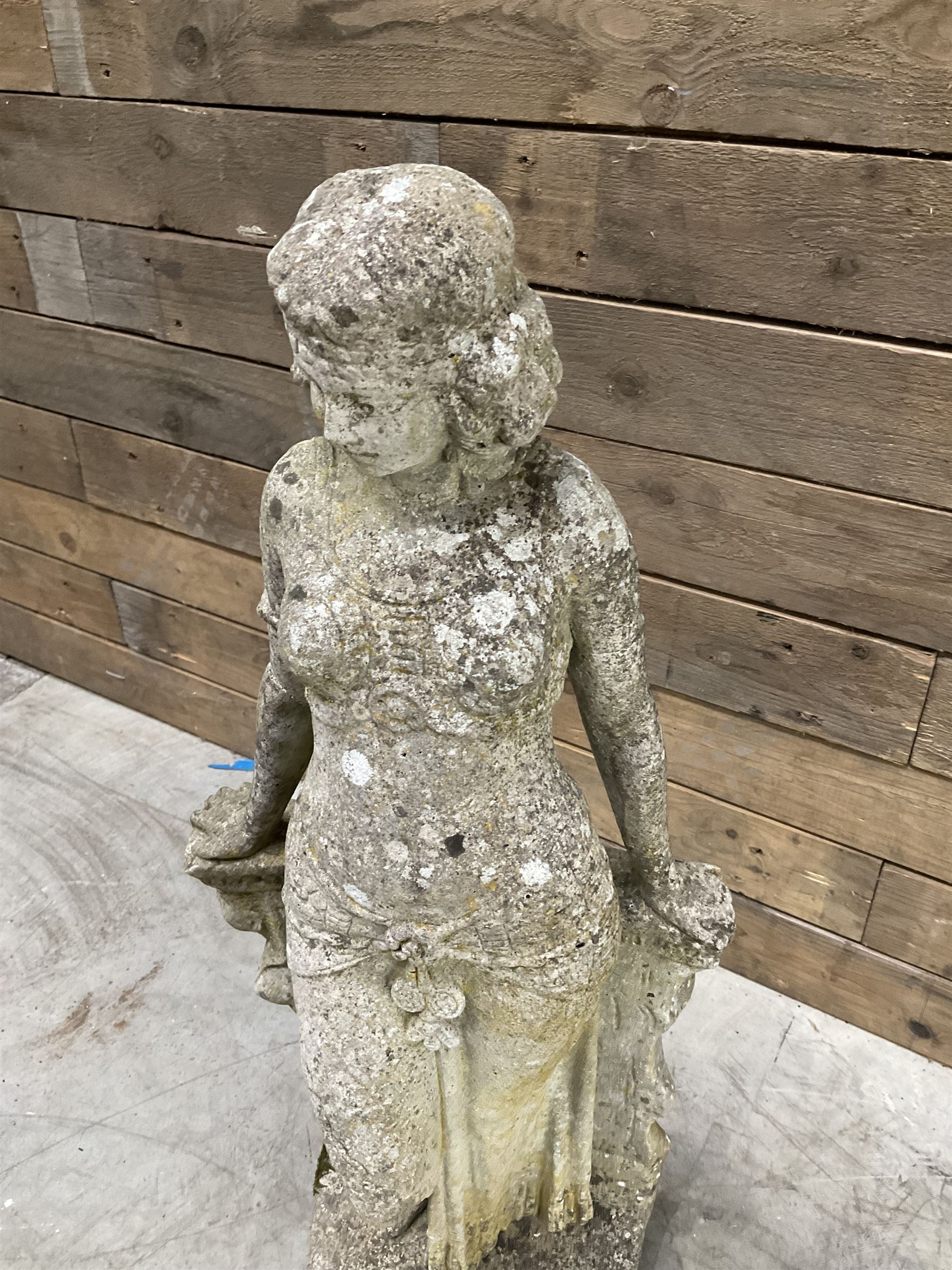 Pair of cast stone garden dogs and 2 female figures,