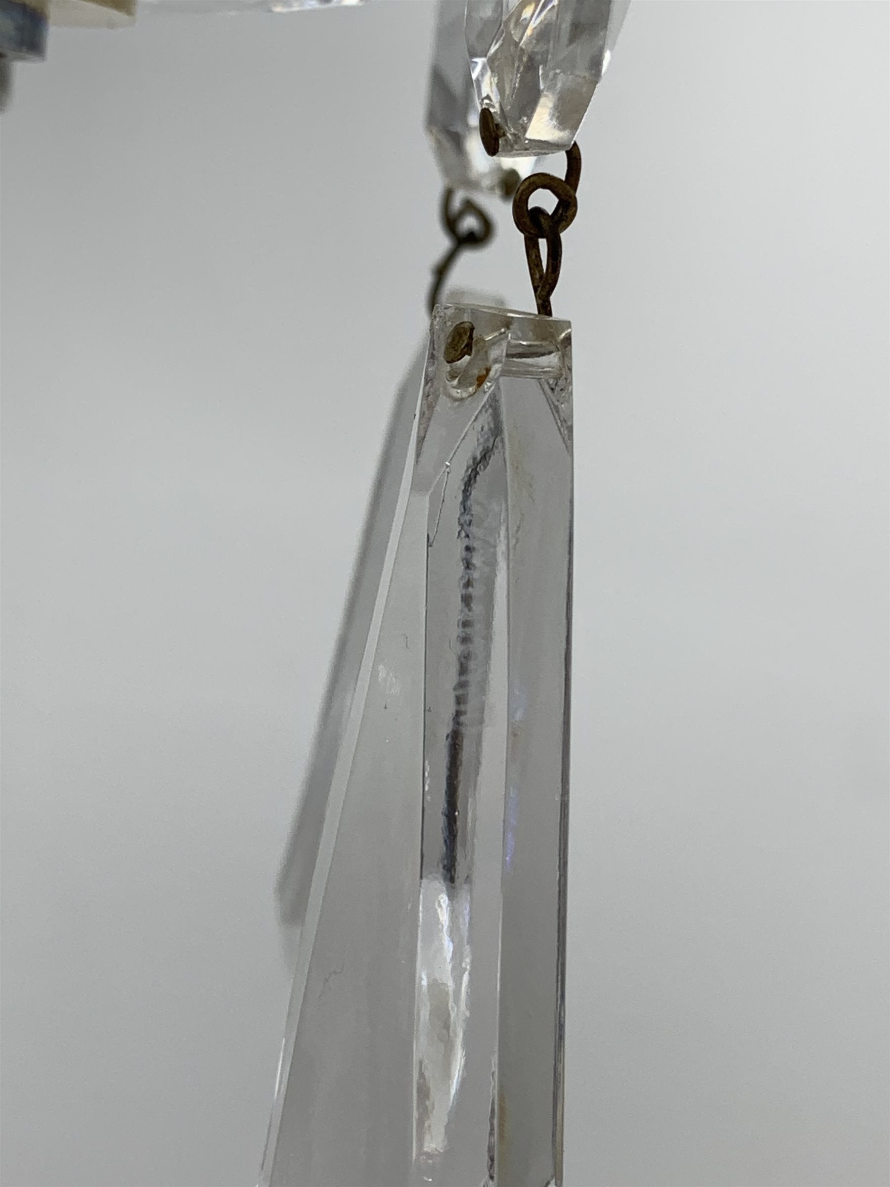 A 20th century Waterford crystal chandelier, the central baluster stem with domed corona, supporting five curved branches with drip pans hung with pendant droplets, approximately H59cm 