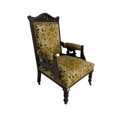 Edwardian mahogany framed gents salon armchair, shaped carved and pierced cresting rail, upholstered back seat and arms, turned supports