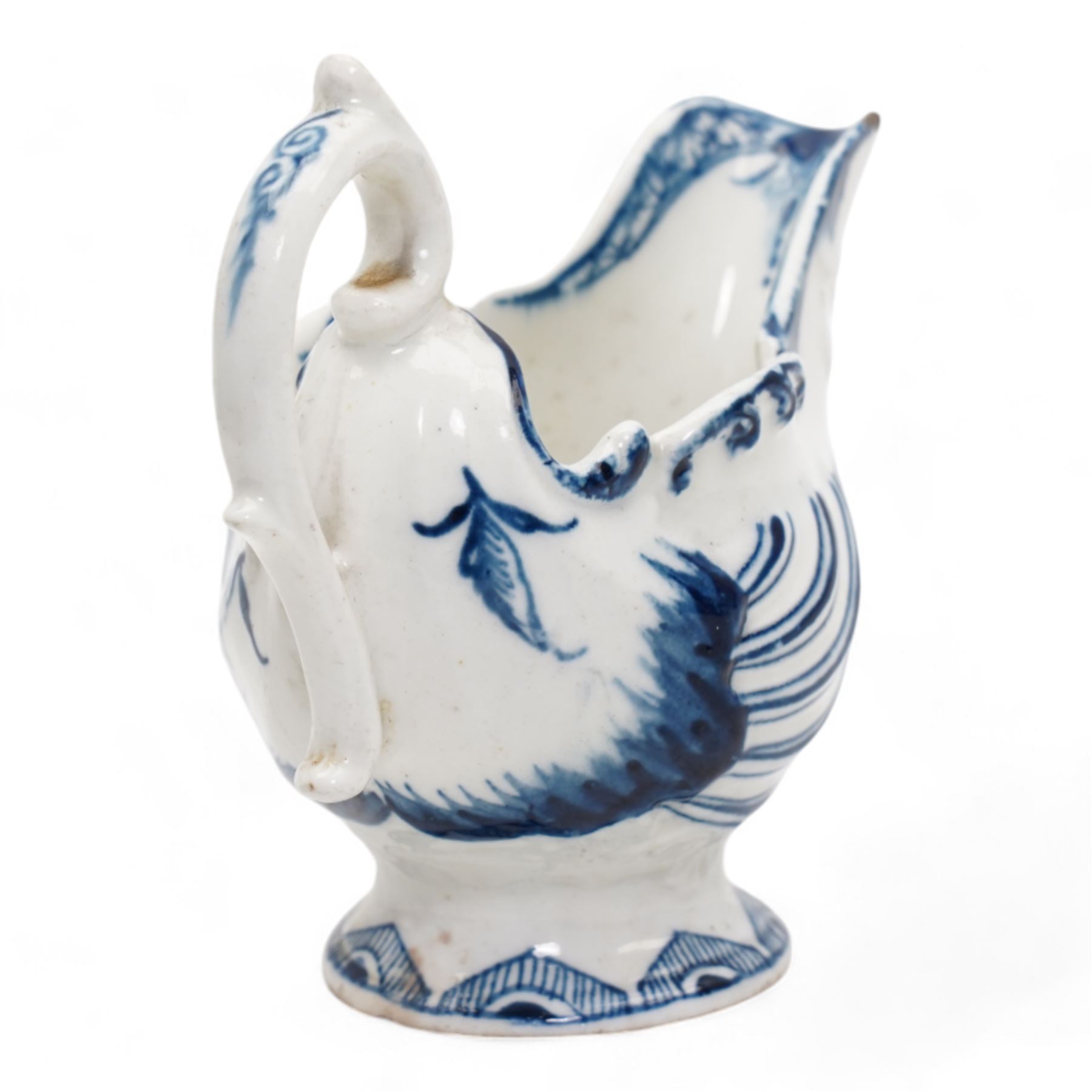 18th century Derby blue butter boat, circa 1770, of helmet form, moulded with shells and dolphin lip, on pedestal foot, H8.5cm x L9.5cm 