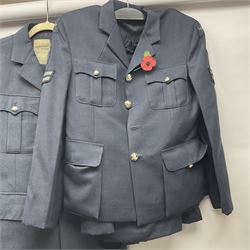 Two post-WWII British Army No.2 Dress tunics, one with Green Howards buttons; army shirt dated 1951; Royal Fleet Auxilliary jacket with trousers; three RAF/WAAF uniforms and RAF Greatcoat; and three canvas/webbing bags, two dated 1943 & 1945