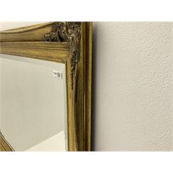 Classical bevel edge gilt mirror, floral detail and shaped moulding, 